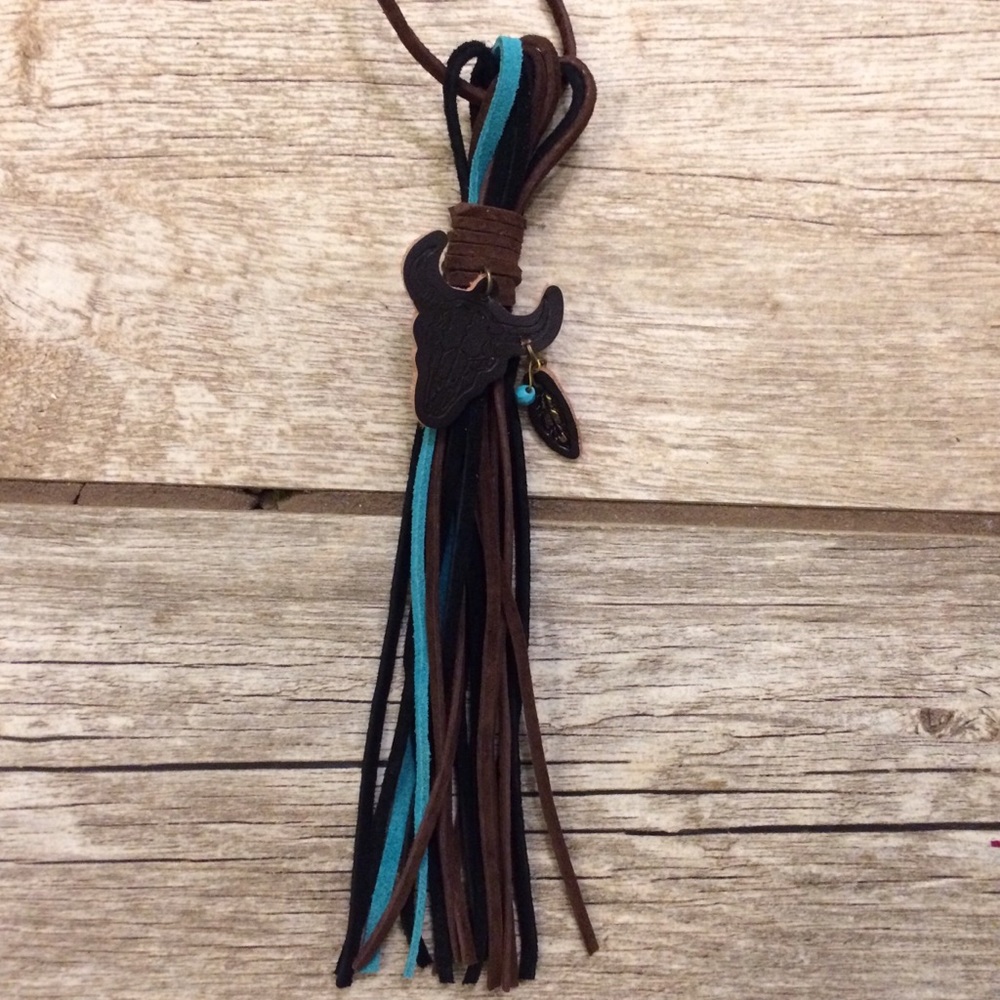 Tooled leather bull skull suede tassel